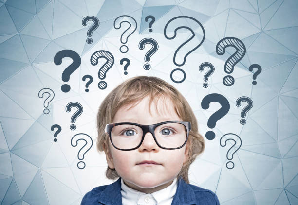 istock Cute little boy in glasses, many questions 1088169506