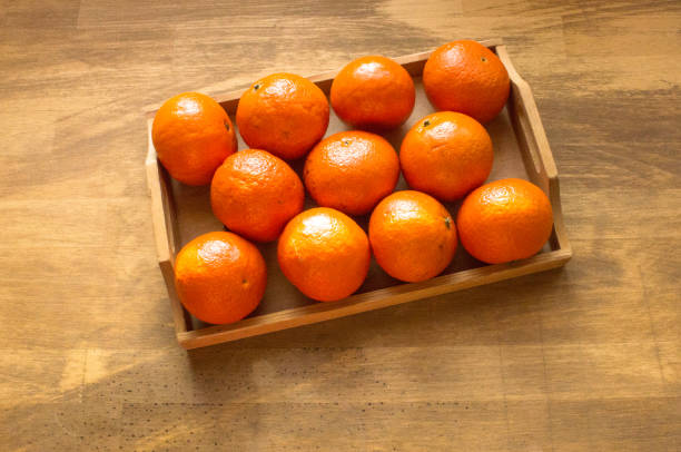 istock fresh ripe tangarines, food closeup on white background. 1088169762