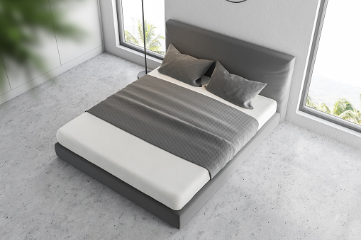 Top view of master bedroom interior with white walls, concrete floor and white and gray master bed in the center. 3d rendering