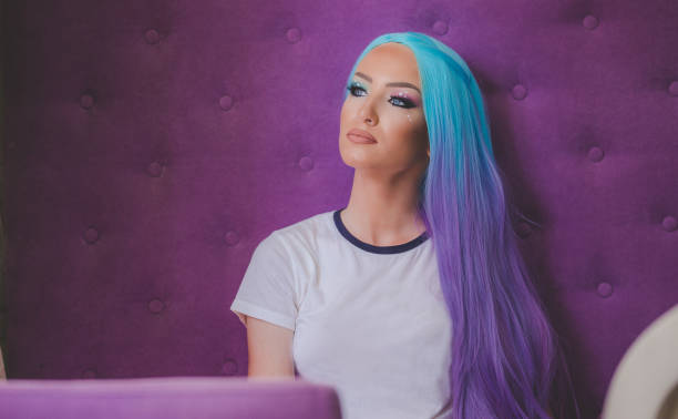 Pretty woman Beautiful woman with blue-purple wig purple hair stock pictures, royalty-free photos & images