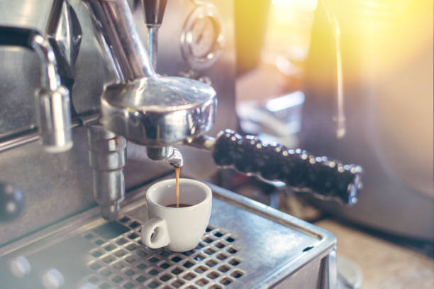 istock Proffessional brewing - coffee bar details. Espresso coffee pouring from espresso machine. 1088191334