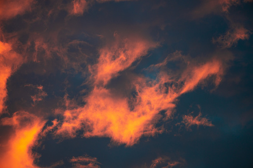 Beautiful sunset. Orange clouds in the sky. Horizon. Twilight