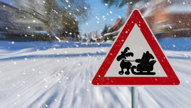 winter landscape with a red Santa Claus road sign in the snow