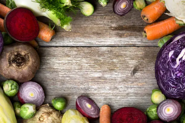 Photo of Wintery vegetables - wooden background