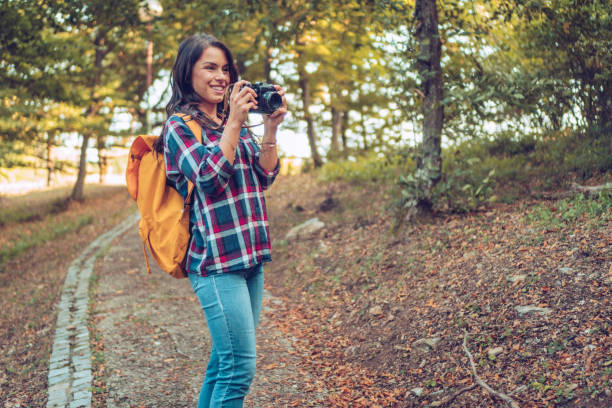 istock Young woman enjoys walking in the forest. 1088211576