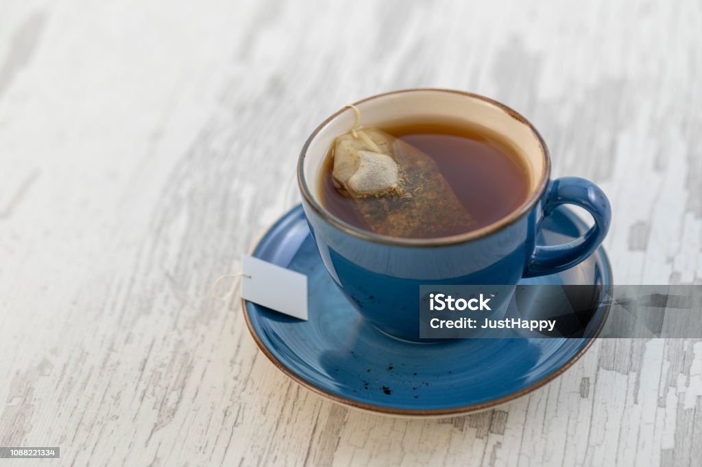 Cup of tea with teabag Dried Tea Leaves Stock Photo