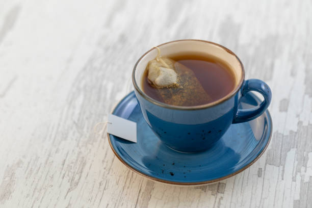 Cup of tea with teabag Cup of tea with teabag black tea stock pictures, royalty-free photos & images