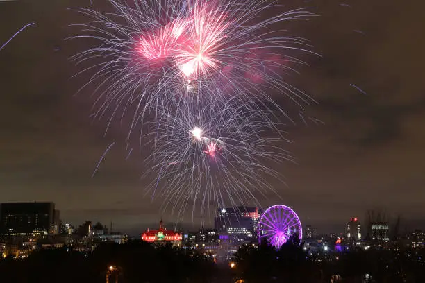 Every year at December 22, Montreal holds a grand fireworks at Old Port for celebration. This is one of the design with purple light.