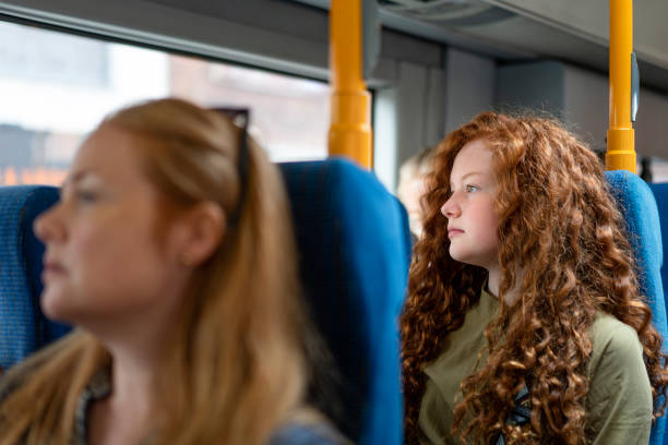 istock Female passengers looking trough window on a bus 1088230816