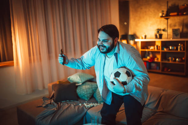 istock Fat man watching soccer 1088234198