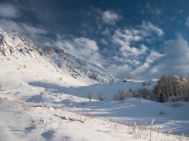 Beautiful amazing nature view.  Mountains in north country Russia Caucasus. Winter snow landscape. Christmas cold panorama.