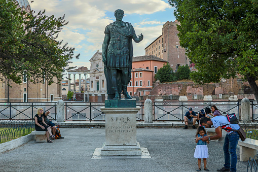Bronze monumental statue of the Caesar in Rome with tourists