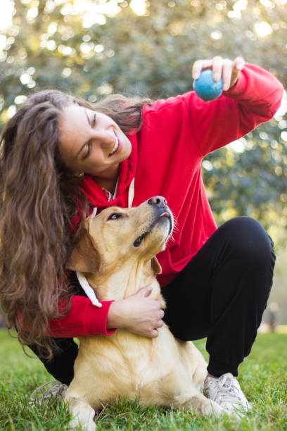 istock Young smiling woman with her cute dog 1088244322