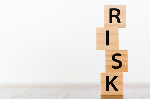 Risk word written on wooden cubes