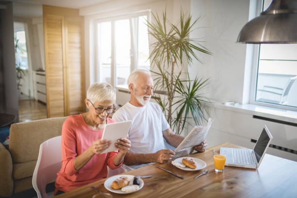 istock Senior couple enjoying breakfast at their hotel suite 1088251064