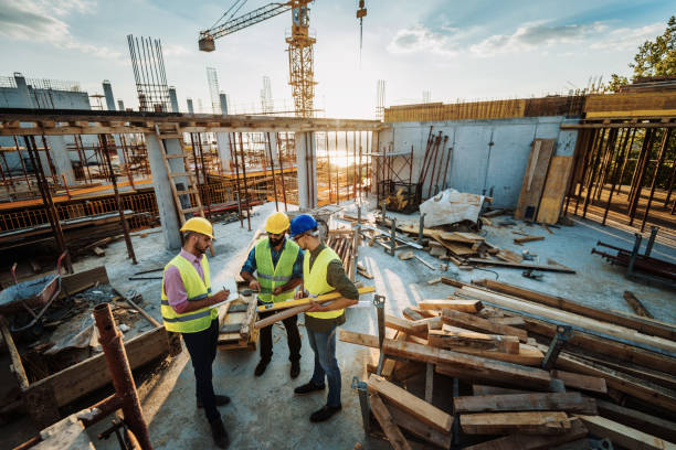 istock Photo of large scale construction site with engineers and construction workers 1088254814