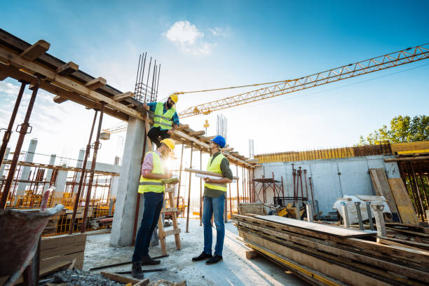 istock Photo of large scale construction site with engineers and construction workers 1088254896