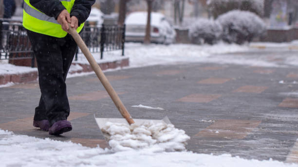istock Man with snow shovel cleans sidewalks in winter. 1088256472