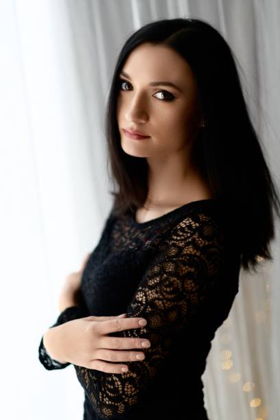 istock Brunette woman posing near window 1088256686
