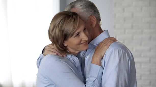 istock Cheerful aged lady and man hugging, harmonious marriage, reliable relations 1088258228