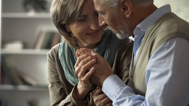 istock Elderly married couple looking at each other with tenderness and holding hands 1088258488