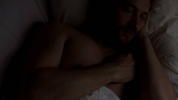 istock Handsome middle aged man sleeping in bed, healthy sleep, night bedtime, top view 1088258680