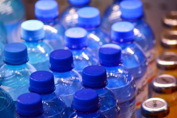 istock Many bottles of clean water with blue lids 1088260620