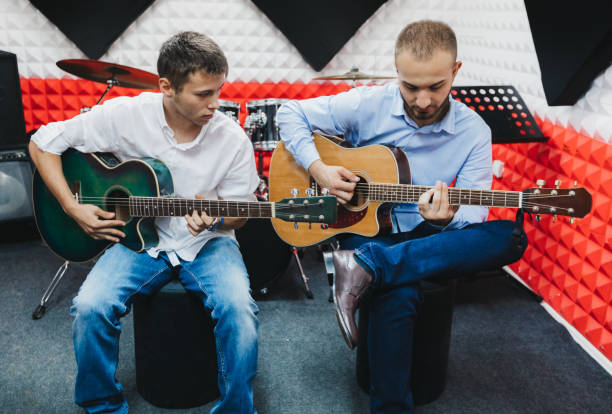 istock Guitar players in a recording studio 1088263630