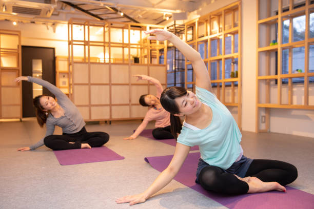 Yoga class in personal gym stock photo
