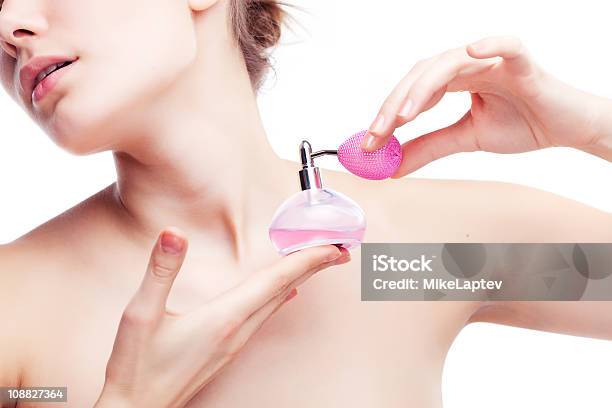 Woman Applying Perfume With Pink Atomizer Stock Photo - Download Image Now - Scented, Women, Perfume