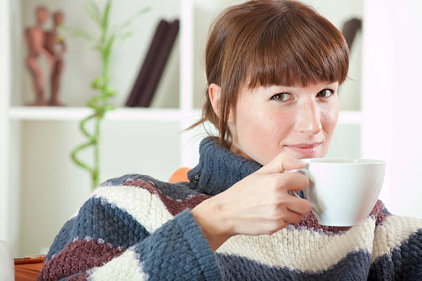 istock woman in sweater drinking tea 108828486