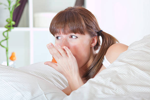 istock yawning woman in bed 108828490