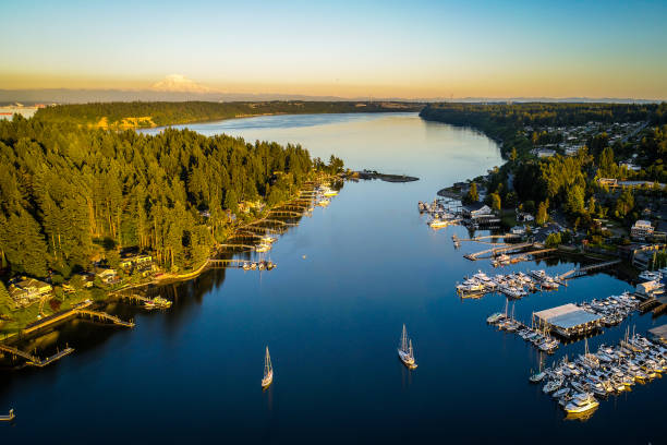 Gig Harbor Washington Aerial Landscape Golden Hour Aerial view of Gig Harbor entrance around sunset plus Mt Rainier puget sound stock pictures, royalty-free photos & images