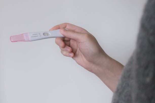 istock Woman Holding Negative Pregnancy Test 1088288162