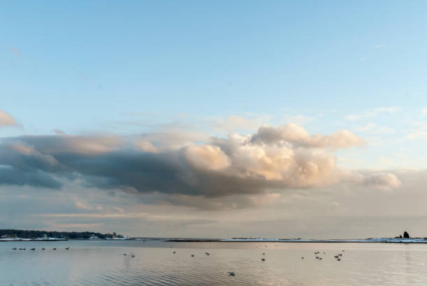 Thick clouds drift over Narragansett Bay at Warwick, Rhode Island on late afternoon in January