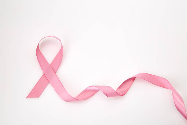 istock Curled pink ribbon on white background 1088296472