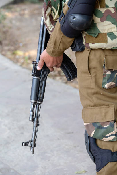 istock Warrior holding a automatic machine gun. New Delhi, India. 1088300762