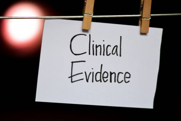 istock Clinical Evidence handwriting on paper. 1088302134