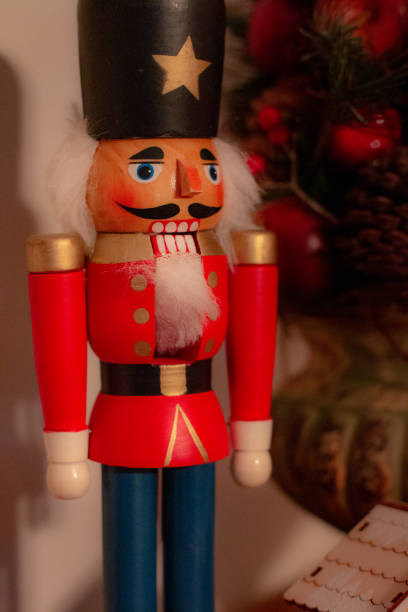 istock Nutcracker with vase of holiday decor. 1088309192