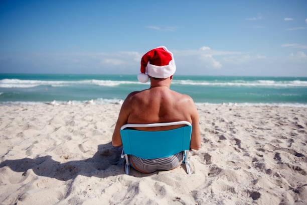 istock Senior at the beach during Christmas time 1088309248