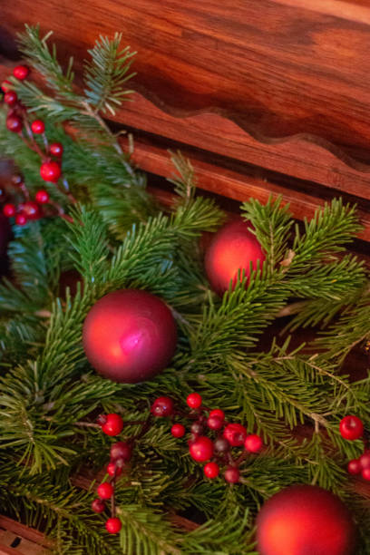 istock Pine branches with red berries and balls in wooden box. 1088310544