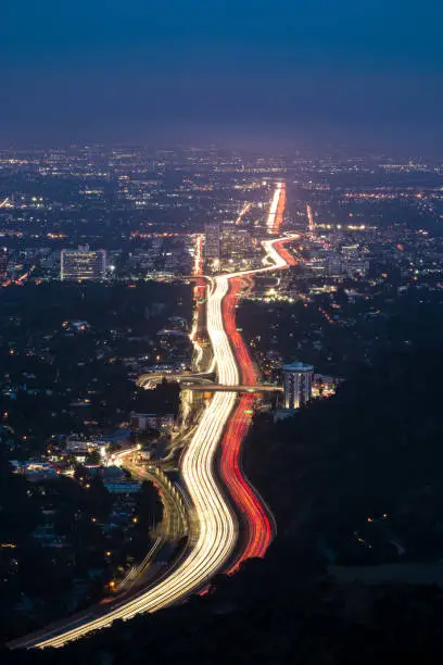 The 405 freeway passing through Westwood during blue hour.