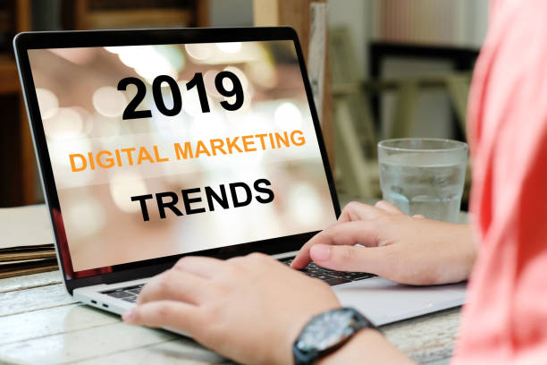 istock Man hand typing laptop computer with 2019 digital marketing trends on screen background, digital marketing, business and technology concept 1088337826