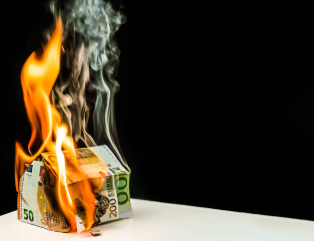 istock detached, burning detached house from euro banknotes 1088341792