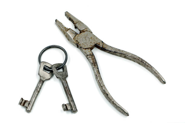 istock old key ring with pliers isolated on white background, top view 1088341896