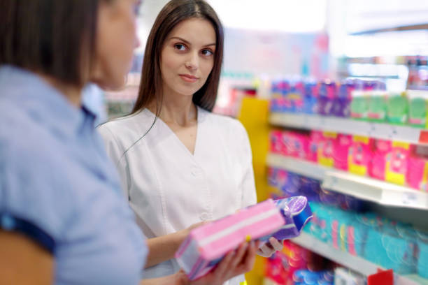 istock Shop assistant helping customer choose sanitary pads 1088349798