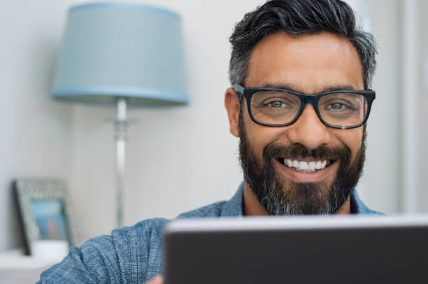 istock Happy smiling man working on laptop 1088355350