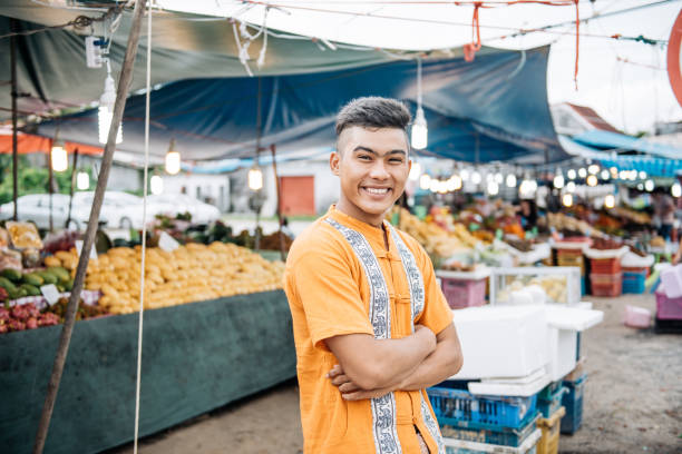 istock Thai farmer selling fruit on the local market 1088365198