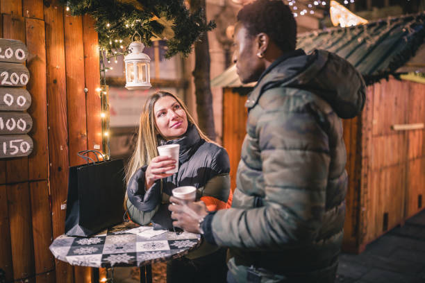 istock Young couple having fun at Christmas market 1088365422