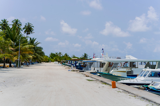 Port with boats at Dhigurah island in Kaafu atoll on Maldives. Dhigurah is opened for foreign tourists and has a \